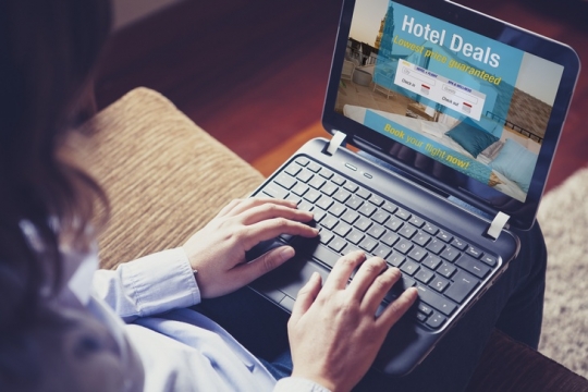 Woman searching a hotel for vacation.